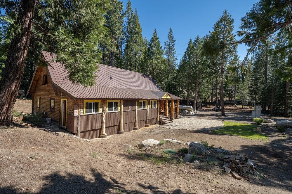 11820 Eagle Lakes Road Nevada City, CA 95959 - Photo 20 of 26 a view of a house with a yard covered in snow
