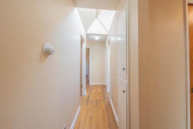 a view of a bathroom from a hallway