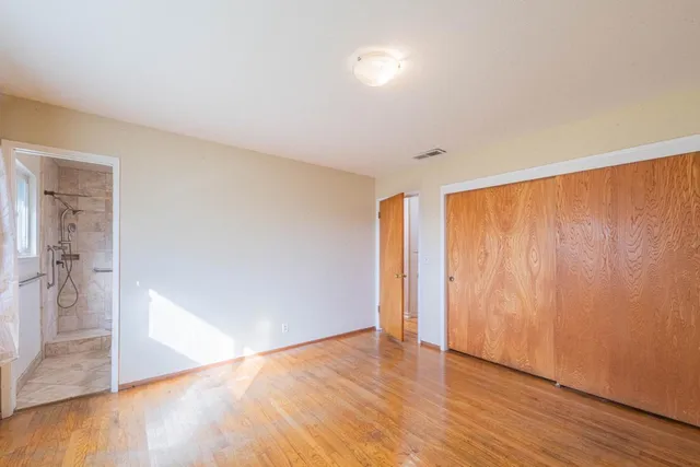 a view of entryway with wooden floor