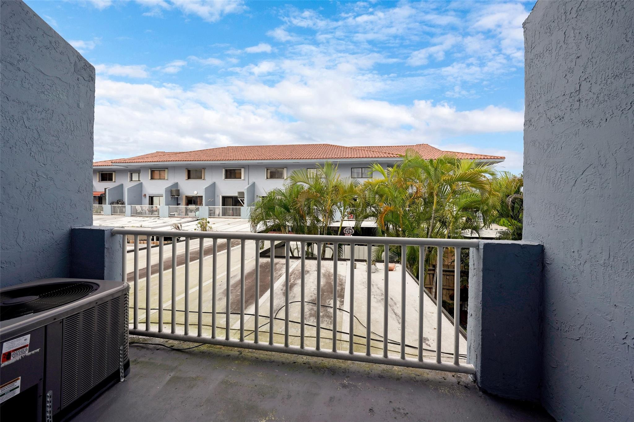 230 West 68th Street, Unit 208 Hialeah, FL 33014 - Photo 15 of 23 a view of a balcony with an outdoor space