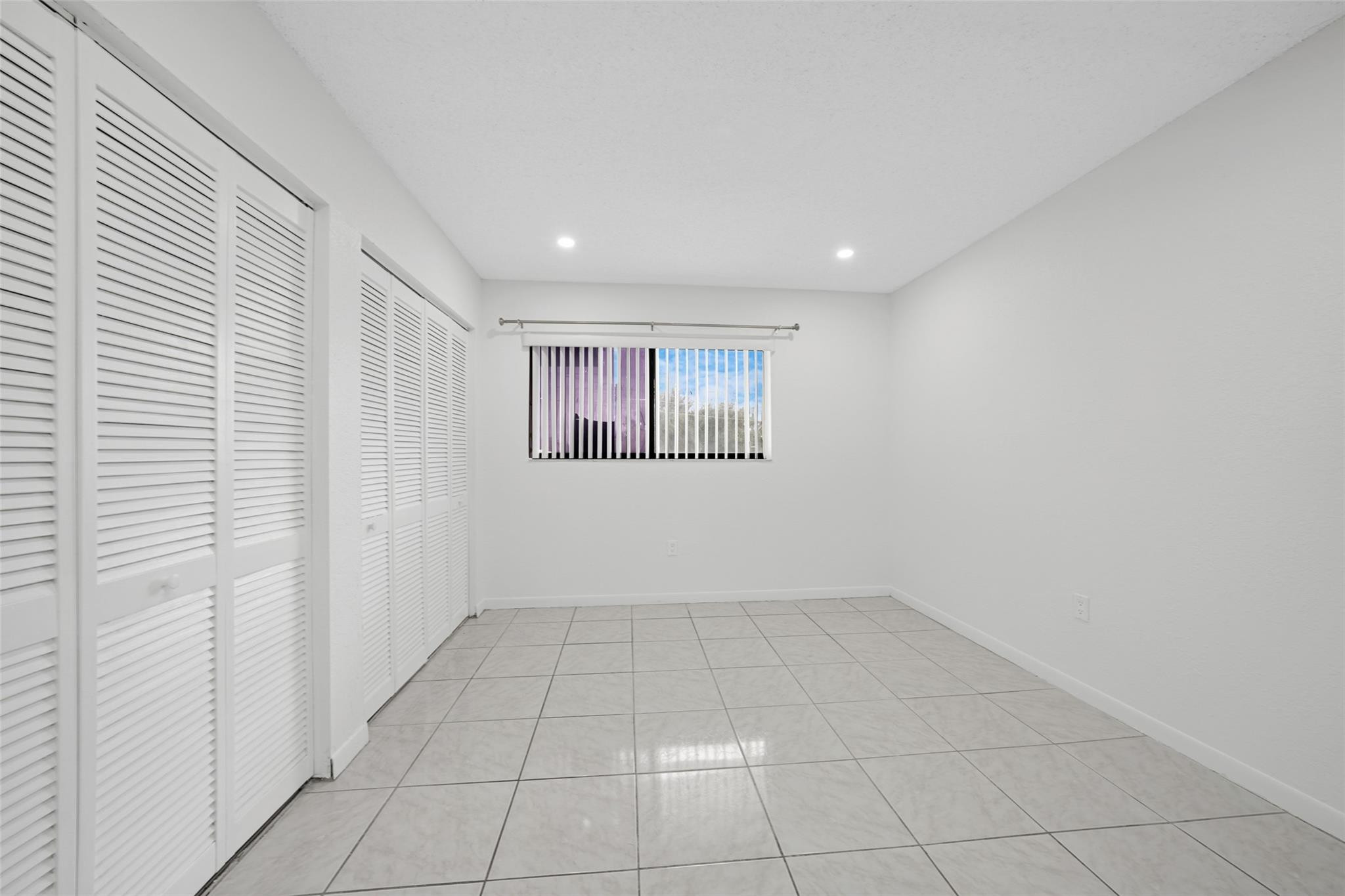 230 West 68th Street, Unit 208 Hialeah, FL 33014 - Photo 19 of 23 a view of an empty room and a window