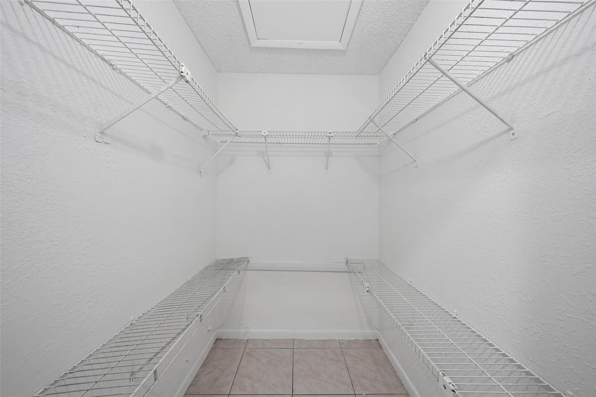 230 West 68th Street, Unit 208 Hialeah, FL 33014 - Photo 20 of 23 a view of a room with racks on the wall