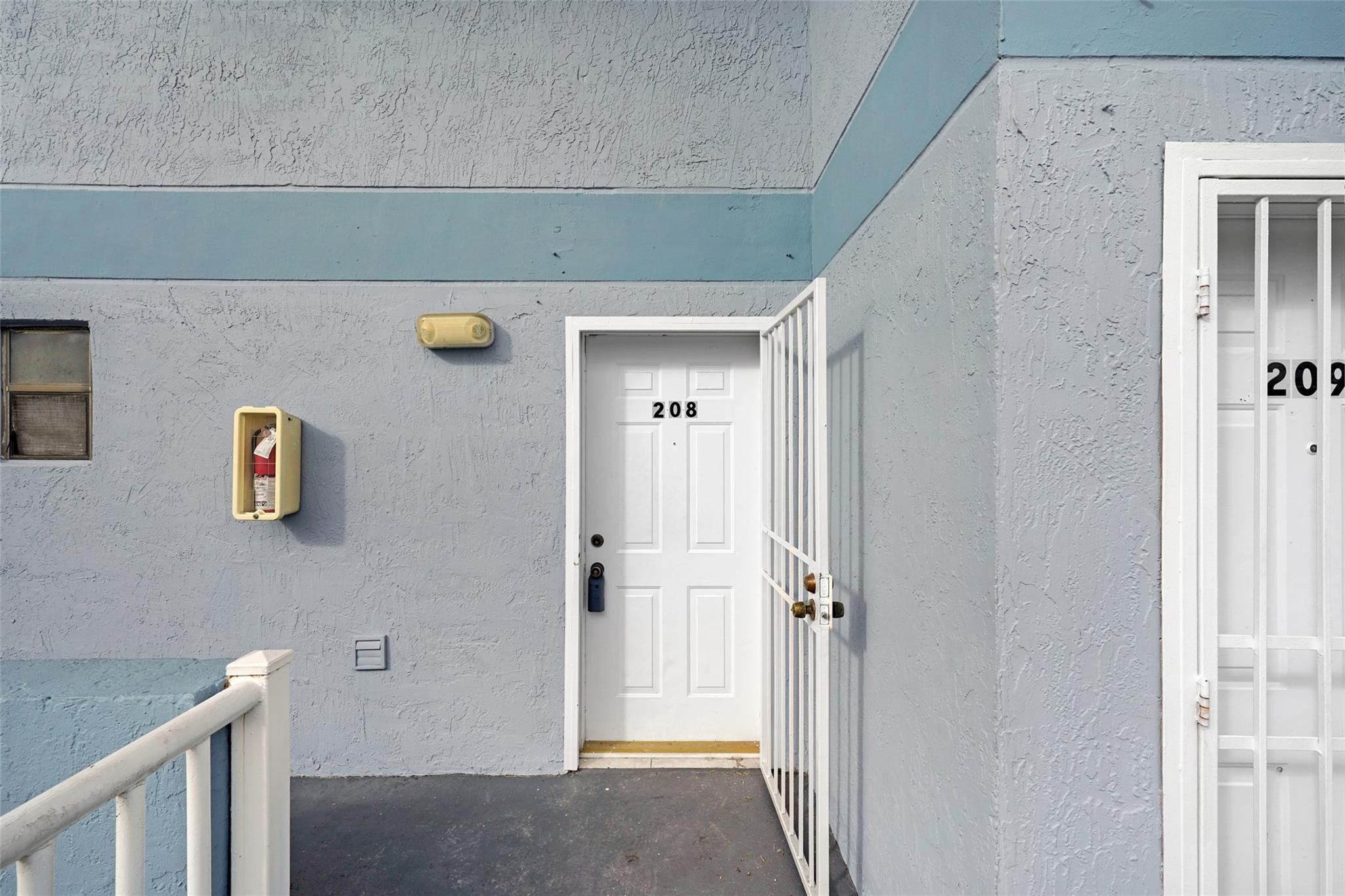 230 West 68th Street, Unit 208 Hialeah, FL 33014 - Photo 3 of 23 a view of a hallway with elevator