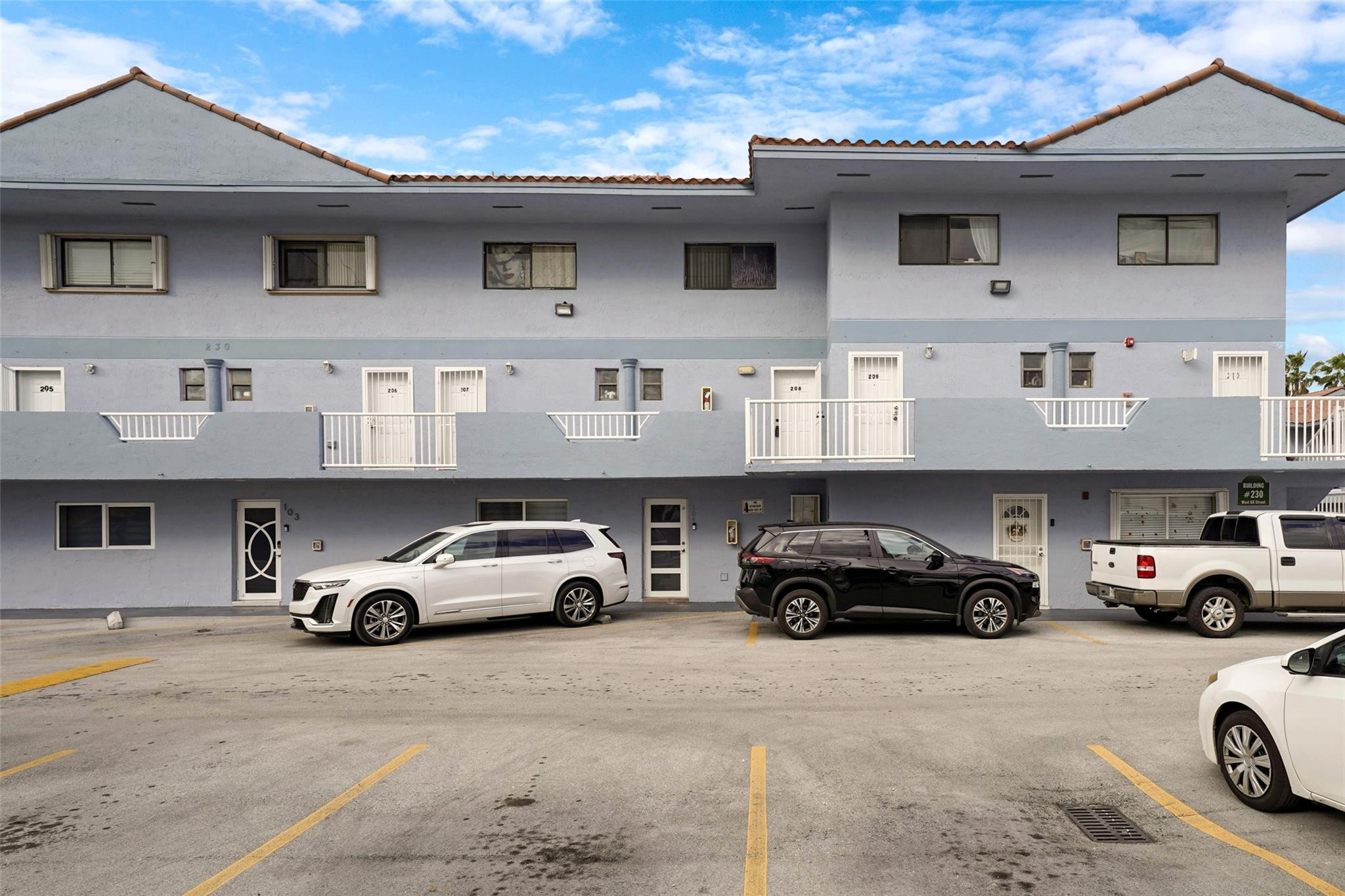 230 West 68th Street, Unit 208 Hialeah, FL 33014 - Photo 4 of 23 a car parked in front of a building