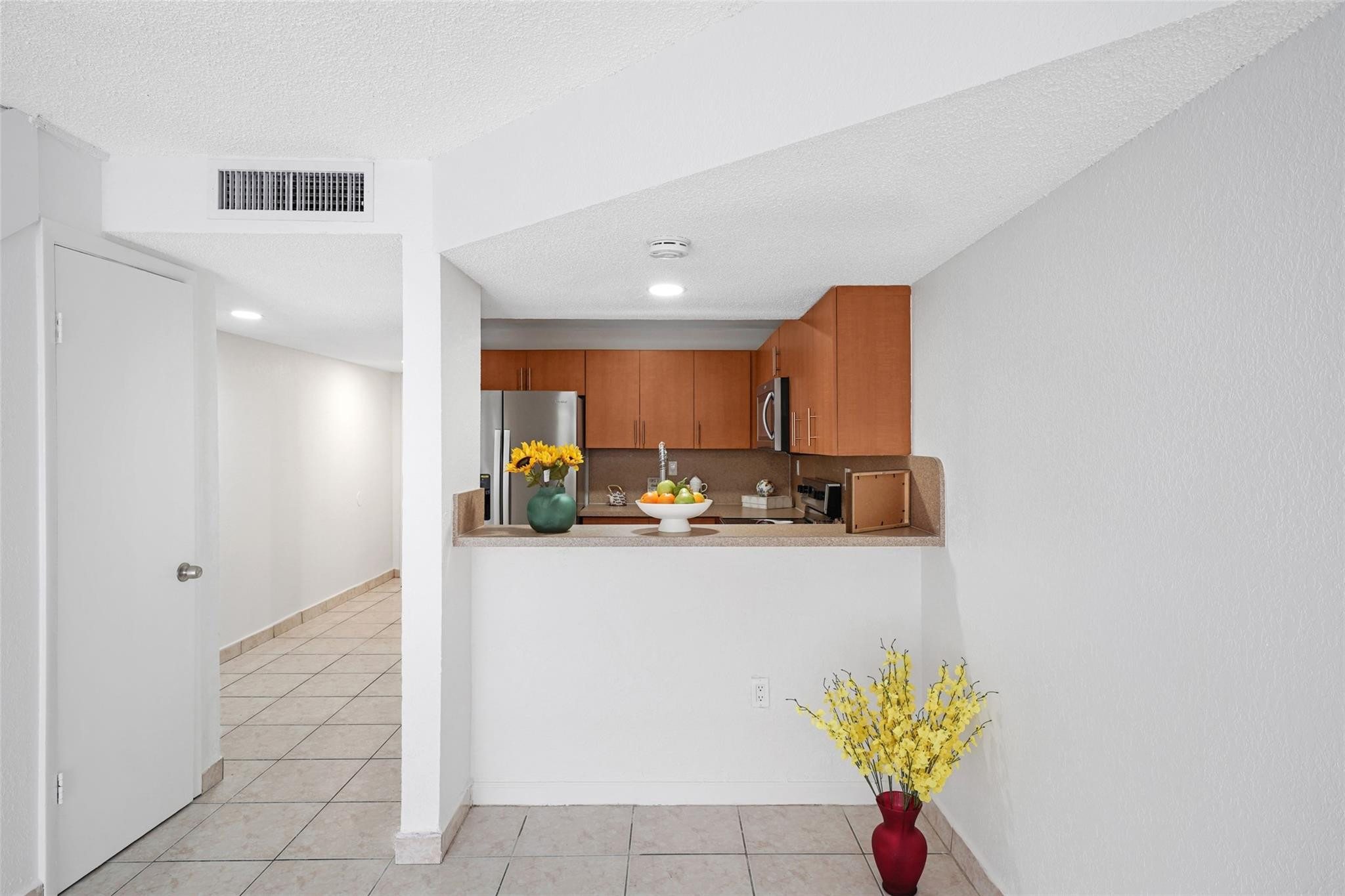 230 West 68th Street, Unit 208 Hialeah, FL 33014 - Photo 9 of 23 a view of kitchen with cabinets and outdoor space