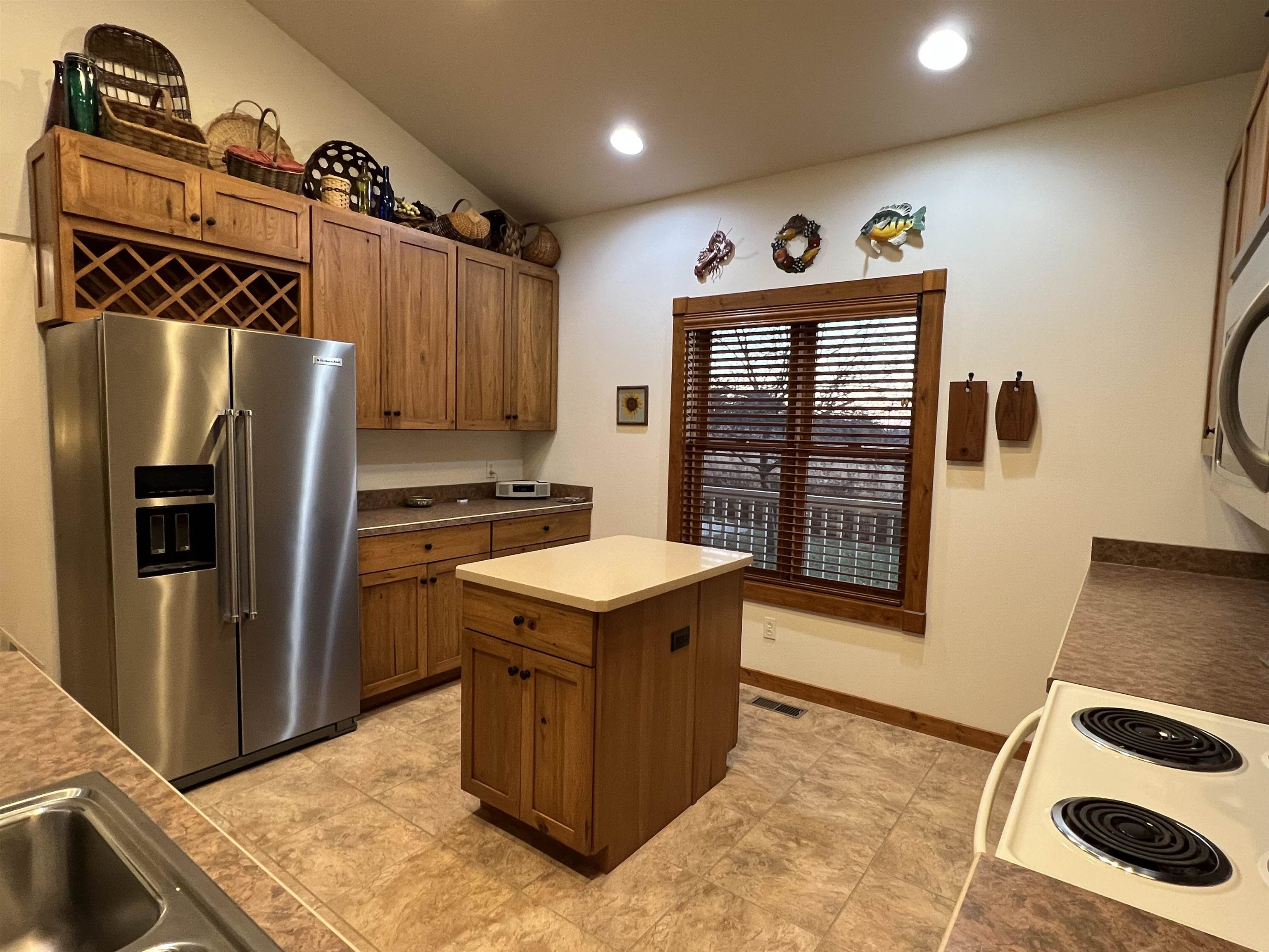 4707 South Elmoville Road Stockton, IL 61085 - Photo 13 of 43 a kitchen with a refrigerator and a stove top oven