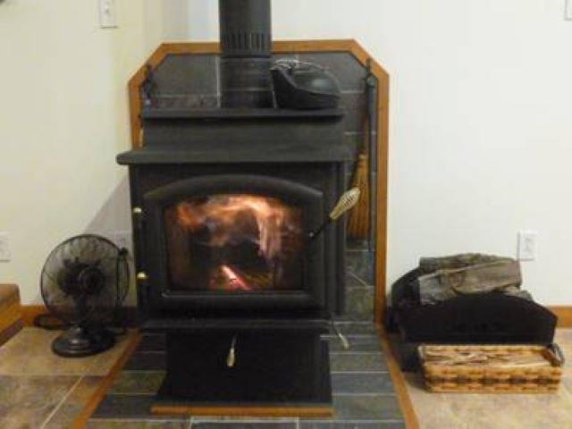 4707 South Elmoville Road Stockton, IL 61085 - Photo 15 of 43 a living room with furniture and a fireplace