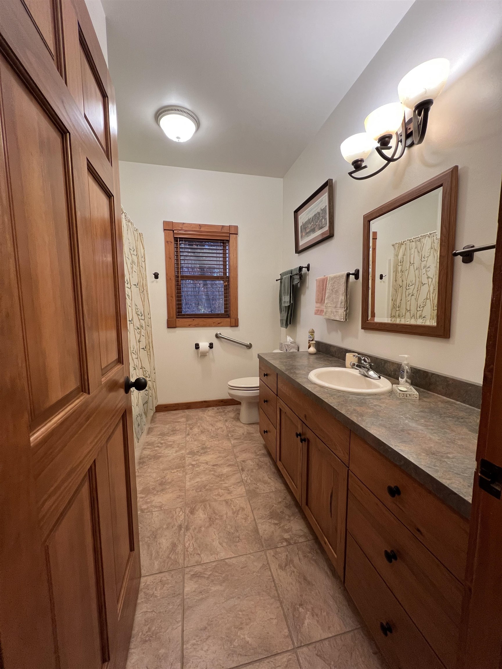 4707 South Elmoville Road Stockton, IL 61085 - Photo 23 of 43 a spacious bathroom with a double vanity sink a mirror and a shower