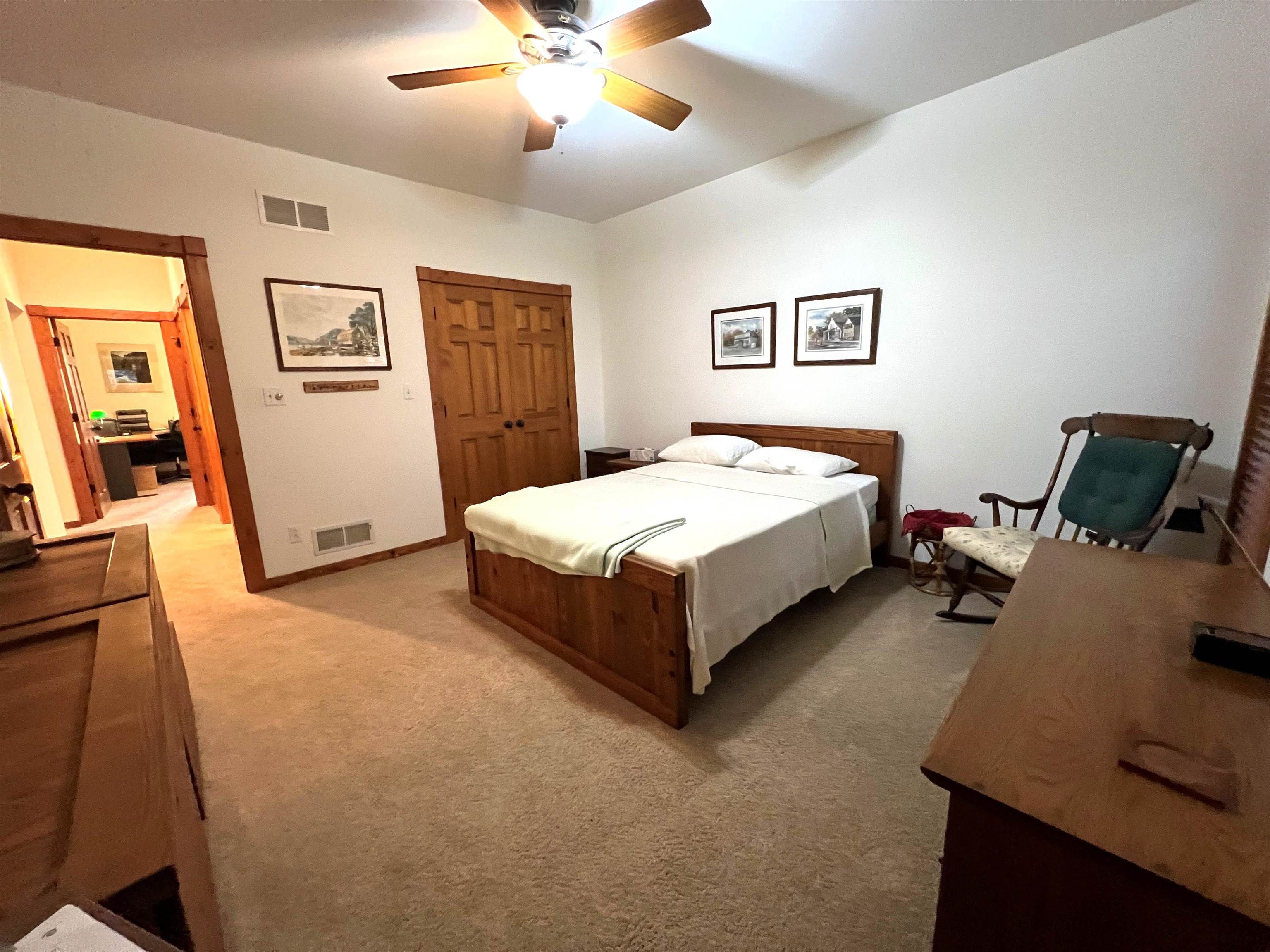 4707 South Elmoville Road Stockton, IL 61085 - Photo 25 of 43 a bedroom with a bed and wooden floor