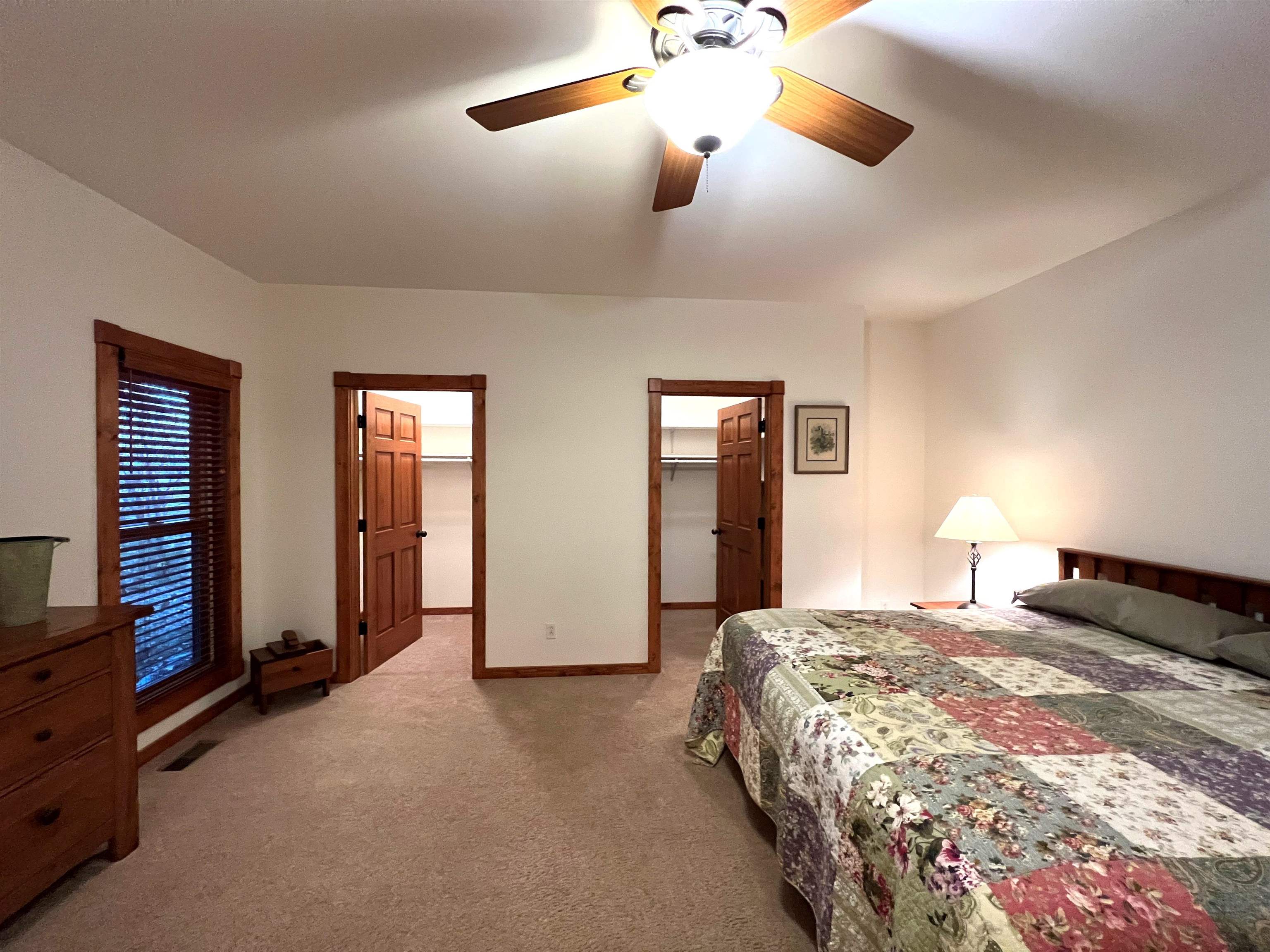 4707 South Elmoville Road Stockton, IL 61085 - Photo 26 of 43 a bedroom with a bed and a chandelier