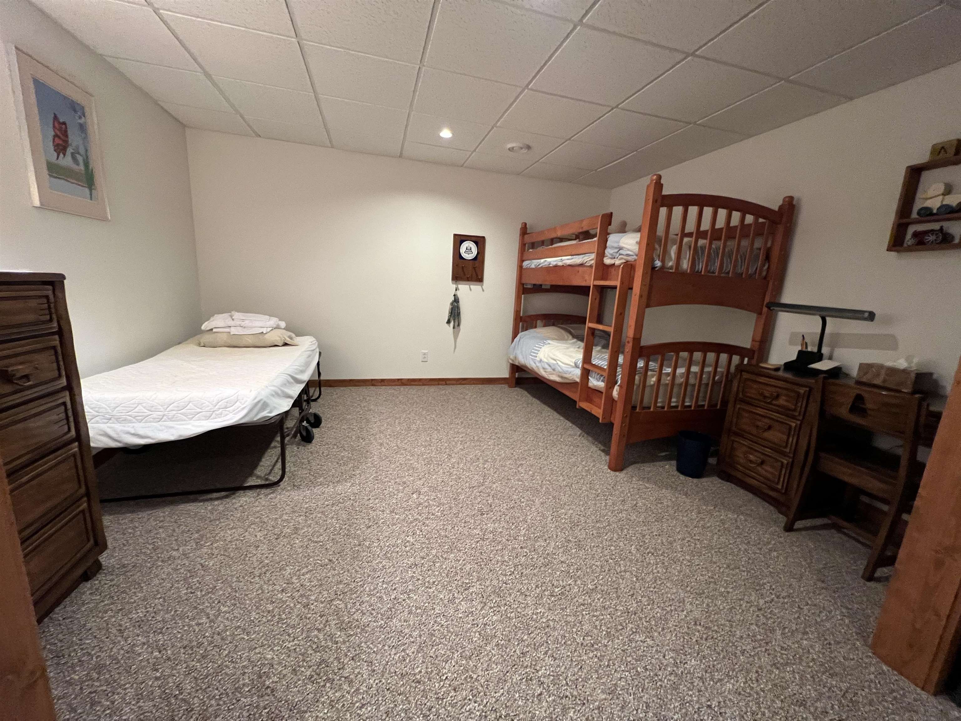 4707 South Elmoville Road Stockton, IL 61085 - Photo 32 of 43 a bedroom with furniture and a chair