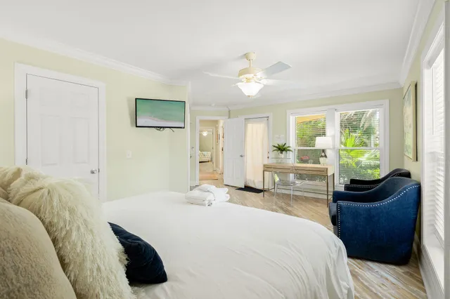 a kitchen with granite countertop a sink and white cabinets