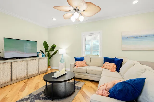 a very nice looking living room with a large window