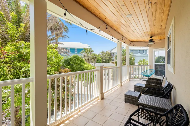 a bedroom with furniture and a chandelier