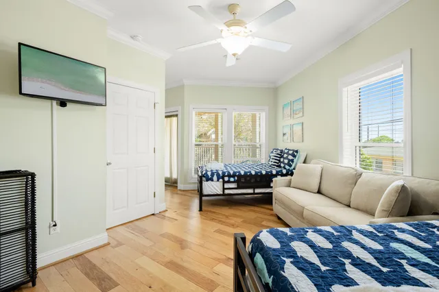 a view of hallway with stairs and wooden floor