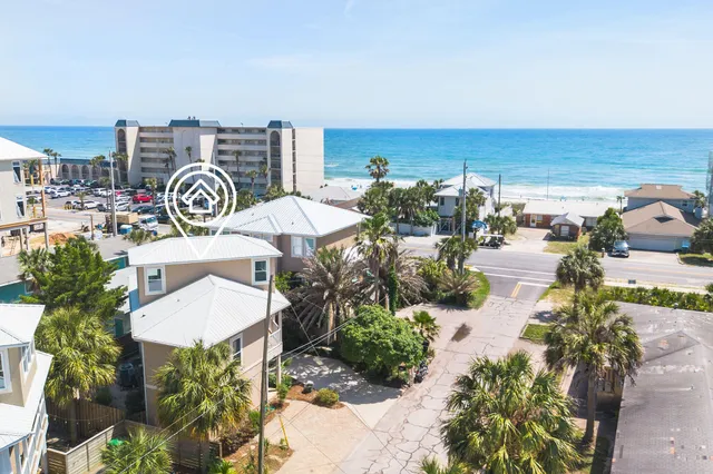 an aerial view of a city with ocean view