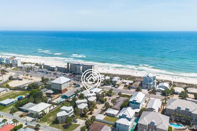 an aerial view of residential houses with city view