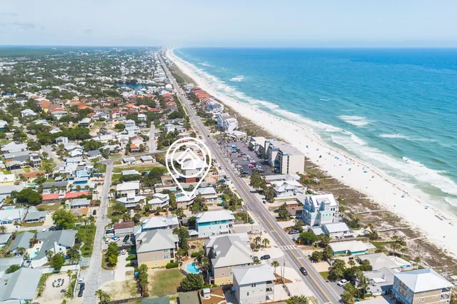 a view of a building with a potted plant and a large window
