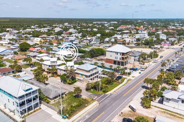a swimming pool with outdoor seating and yard