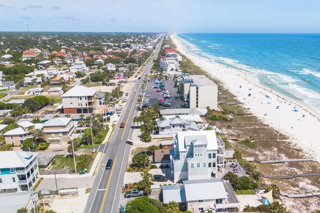 a swimming pool with outdoor seating and yard