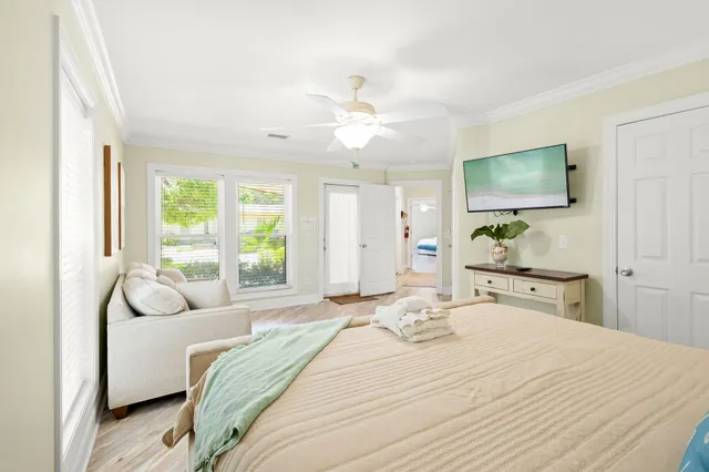 a bedroom with a bed and a flat screen tv