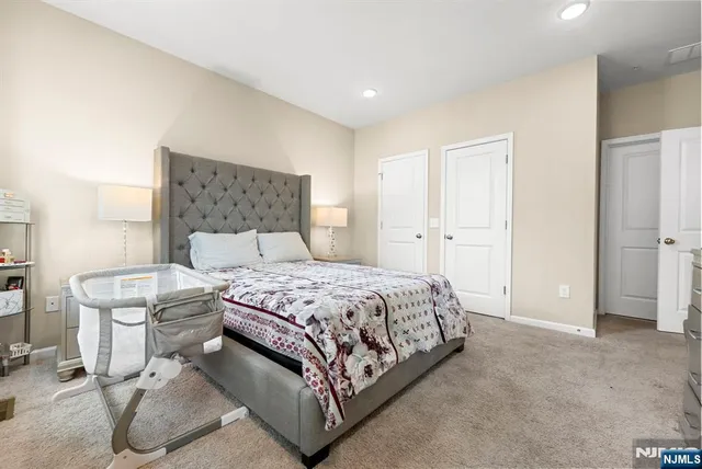 a bedroom with a bed and a cabinets