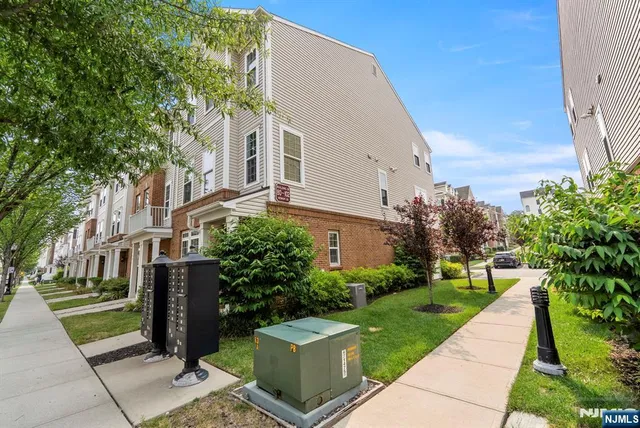 a view of a building with a yard