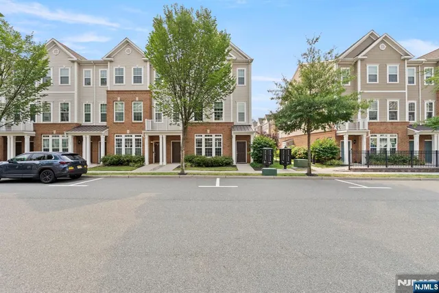 a view of multiple houses with a street
