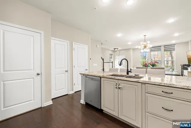 a kitchen with sink and cabinets