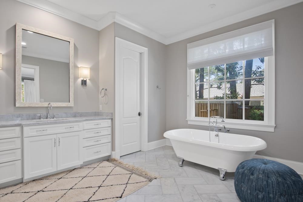 76 Waring Road Memphis, TN 38117 - Photo 17 of 25 a spacious bathroom with a tub sink and mirror