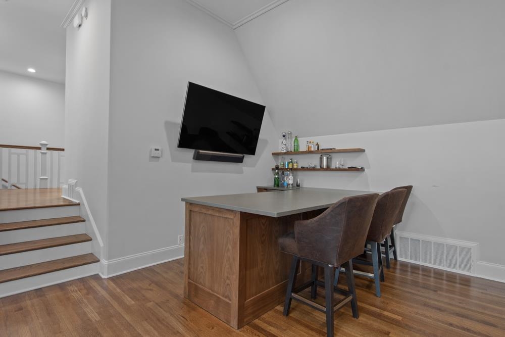 76 Waring Road Memphis, TN 38117 - Photo 23 of 25 a view of a dining room with furniture and wooden floor