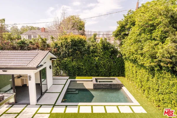 a view of a balcony with yard