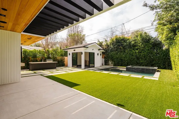 a view of swimming pool with seating area and furniture
