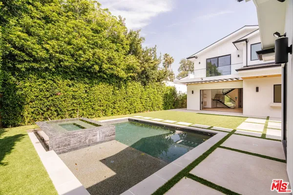 a view of an outdoor space with swimming pool