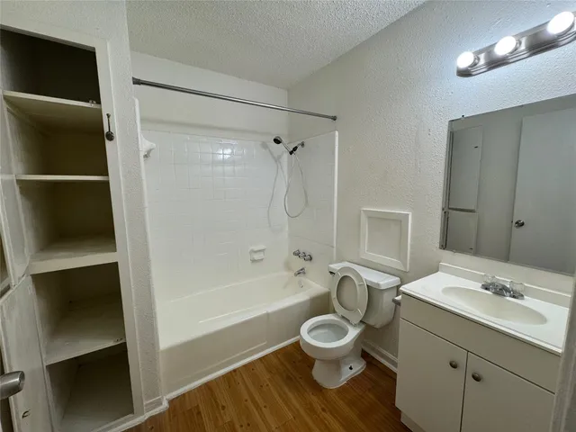 a bathroom with a sink toilet a shower and bathtub