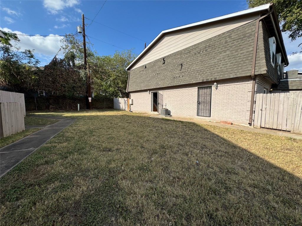 4902 West Wind Trail, Unit 104 Austin, TX 78745 - Photo 18 of 18 a backyard of a house