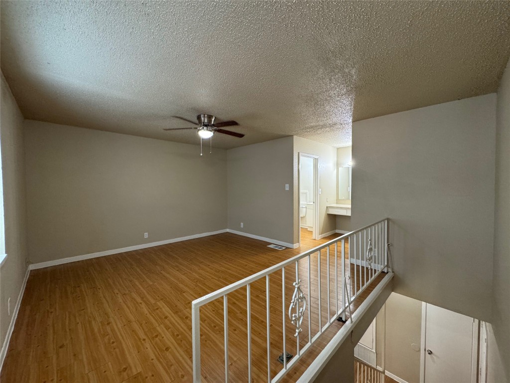 4902 West Wind Trail, Unit 104 Austin, TX 78745 - Photo 10 of 18 a view of a hallway with an entryway