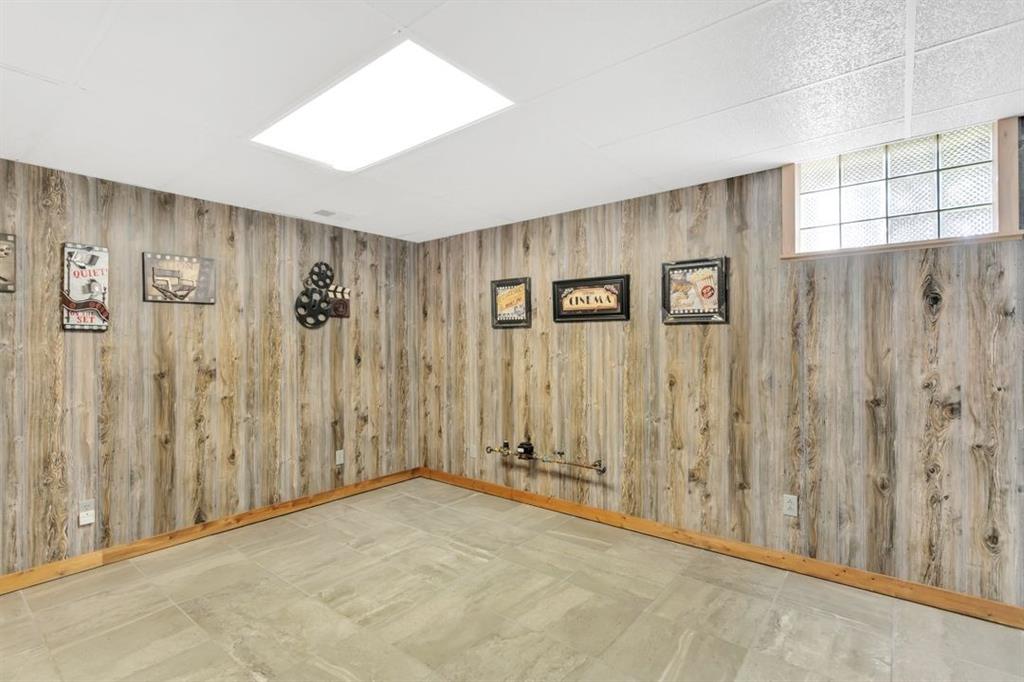 100 Shortcut Road Baden, PA 15005 - Photo 19 of 25 The basement level game room features ceramic tile flooring.