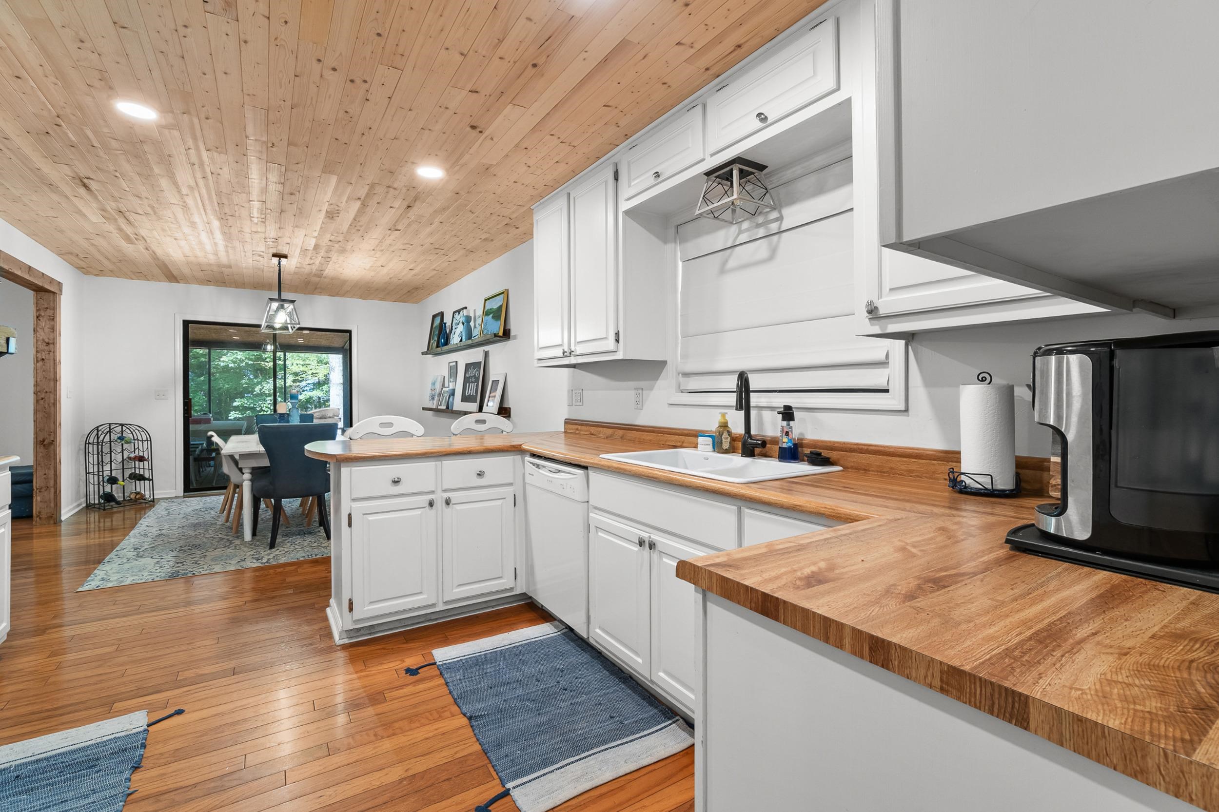 90 Roberts Drive Cherokee, MS 35616 - Photo 13 of 38 a kitchen with granite countertop a sink stove and cabinets