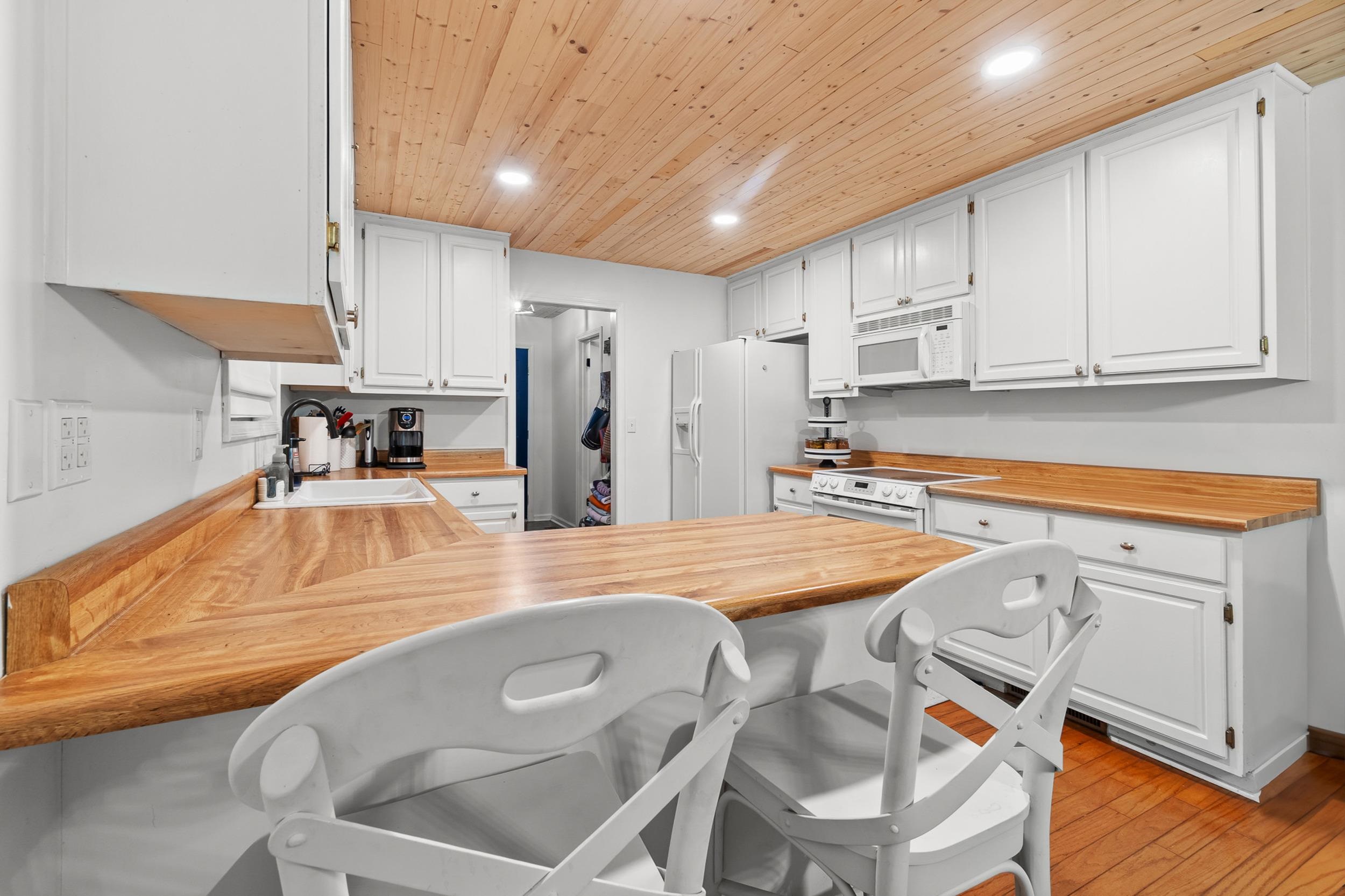 90 Roberts Drive Cherokee, MS 35616 - Photo 14 of 38 a kitchen with stainless steel appliances granite countertop a sink refrigerator and cabinets