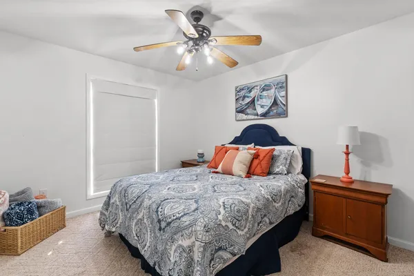 a bedroom with a bed and dresser