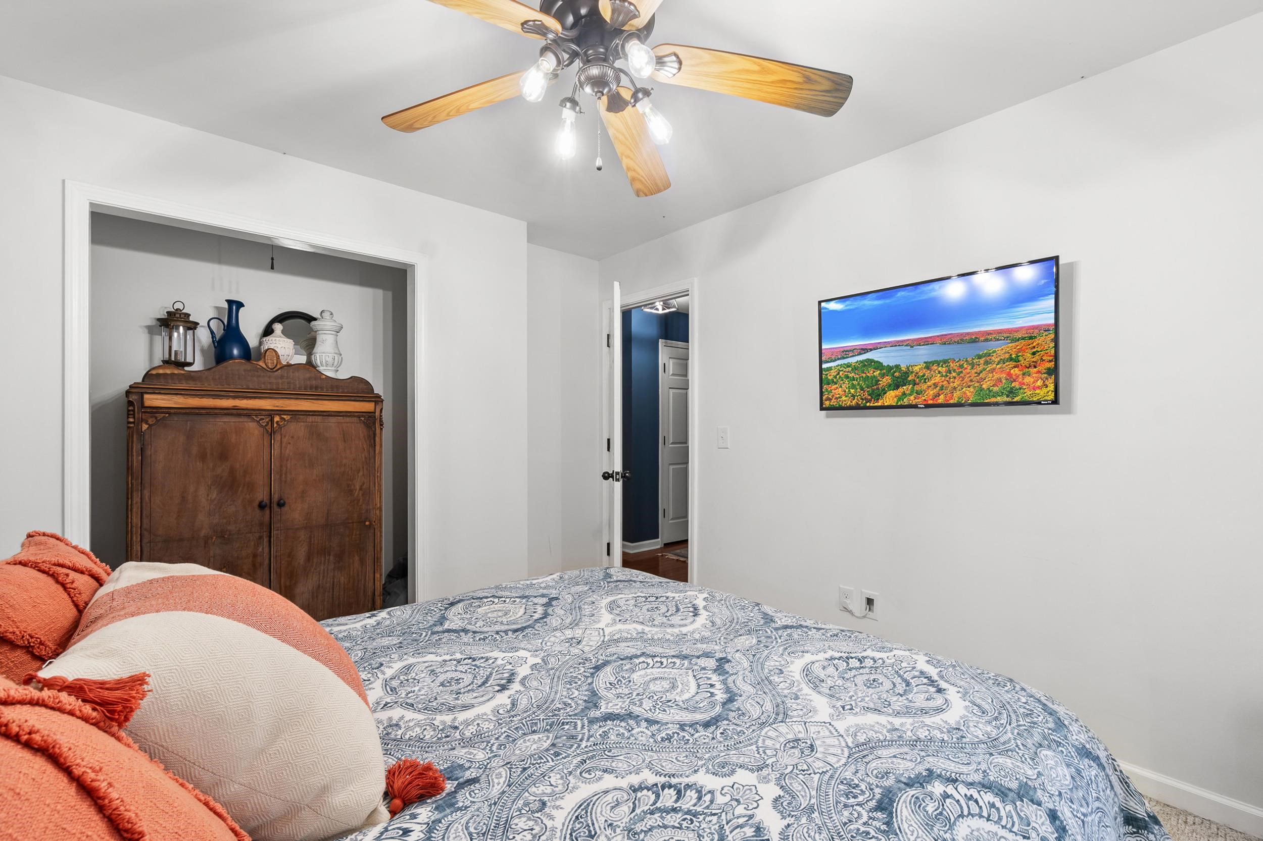 90 Roberts Drive Cherokee, MS 35616 - Photo 21 of 38 a bedroom with a bed and a painting on the wall