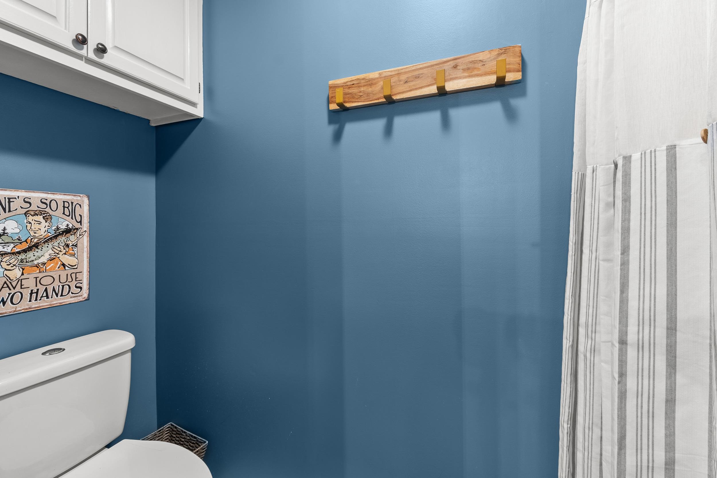 90 Roberts Drive Cherokee, MS 35616 - Photo 23 of 38 a white toilet sitting next to a shower curtain