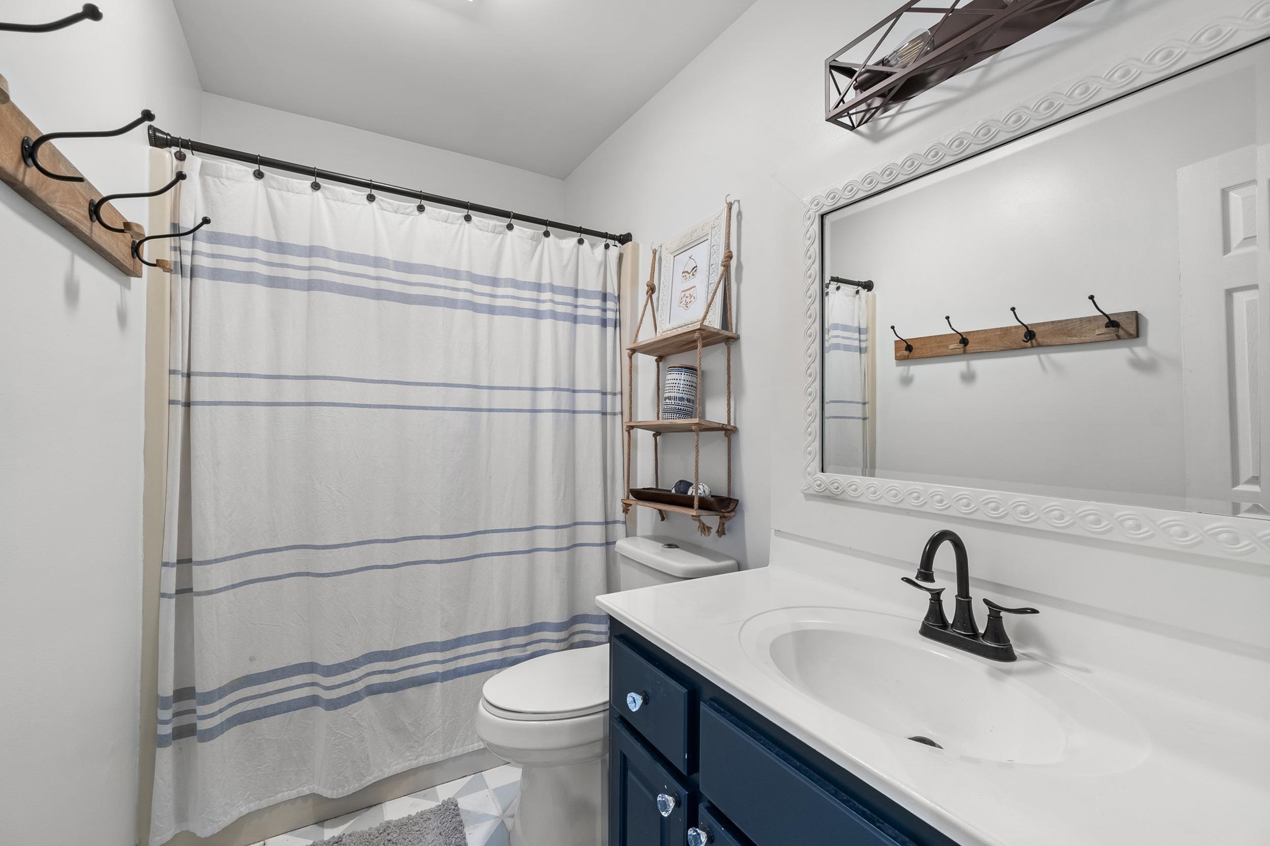 90 Roberts Drive Cherokee, MS 35616 - Photo 26 of 38 a bathroom with a sink toilet and shower