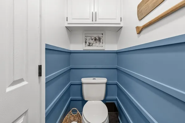 a bathroom with a toilet and a sink