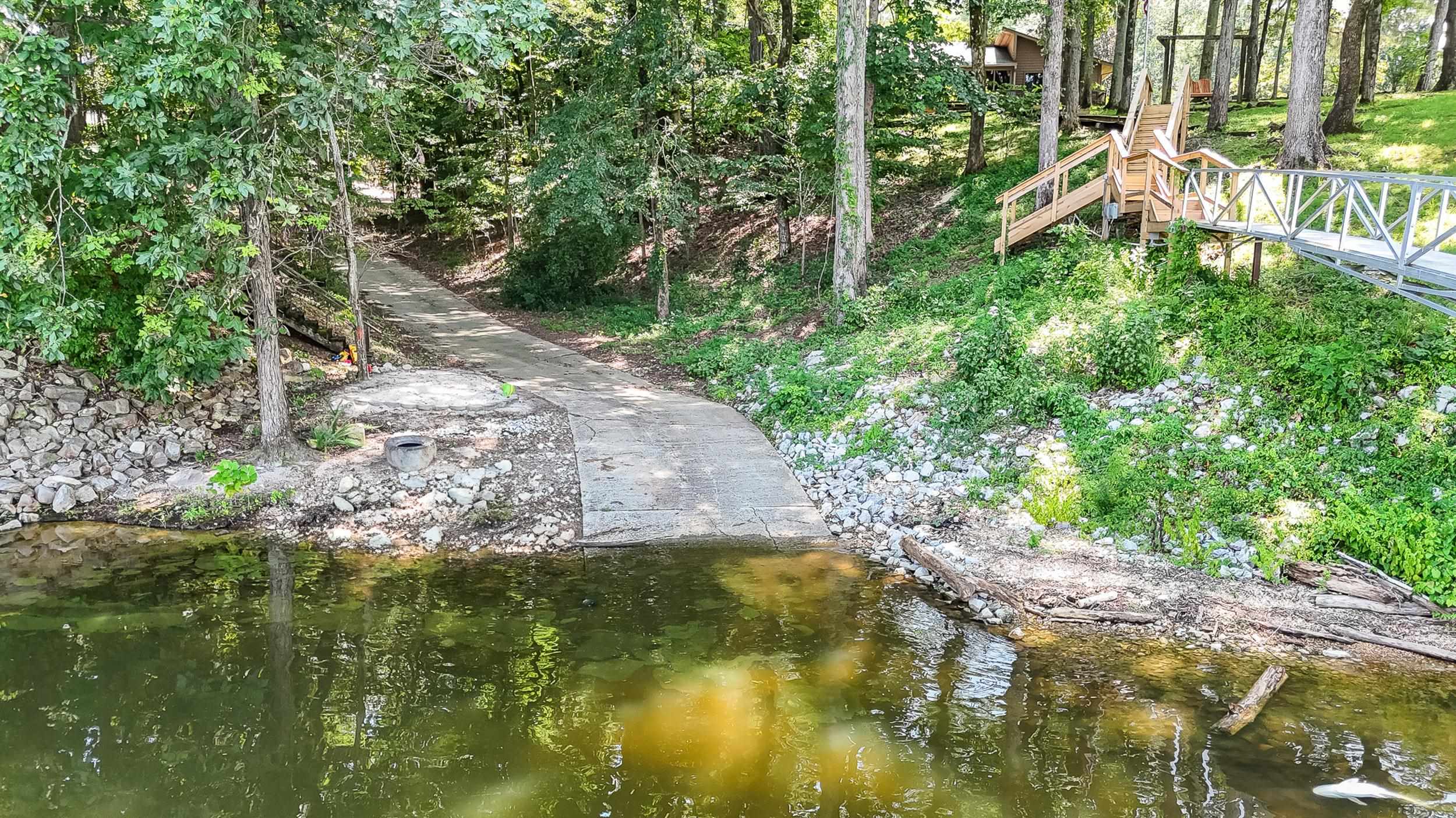 90 Roberts Drive Cherokee, MS 35616 - Photo 7 of 38 a view of a yard with plants and large trees