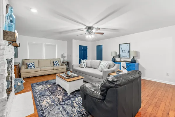 a living room with furniture and a rug