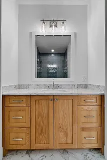 a bathroom with a toilet and shower