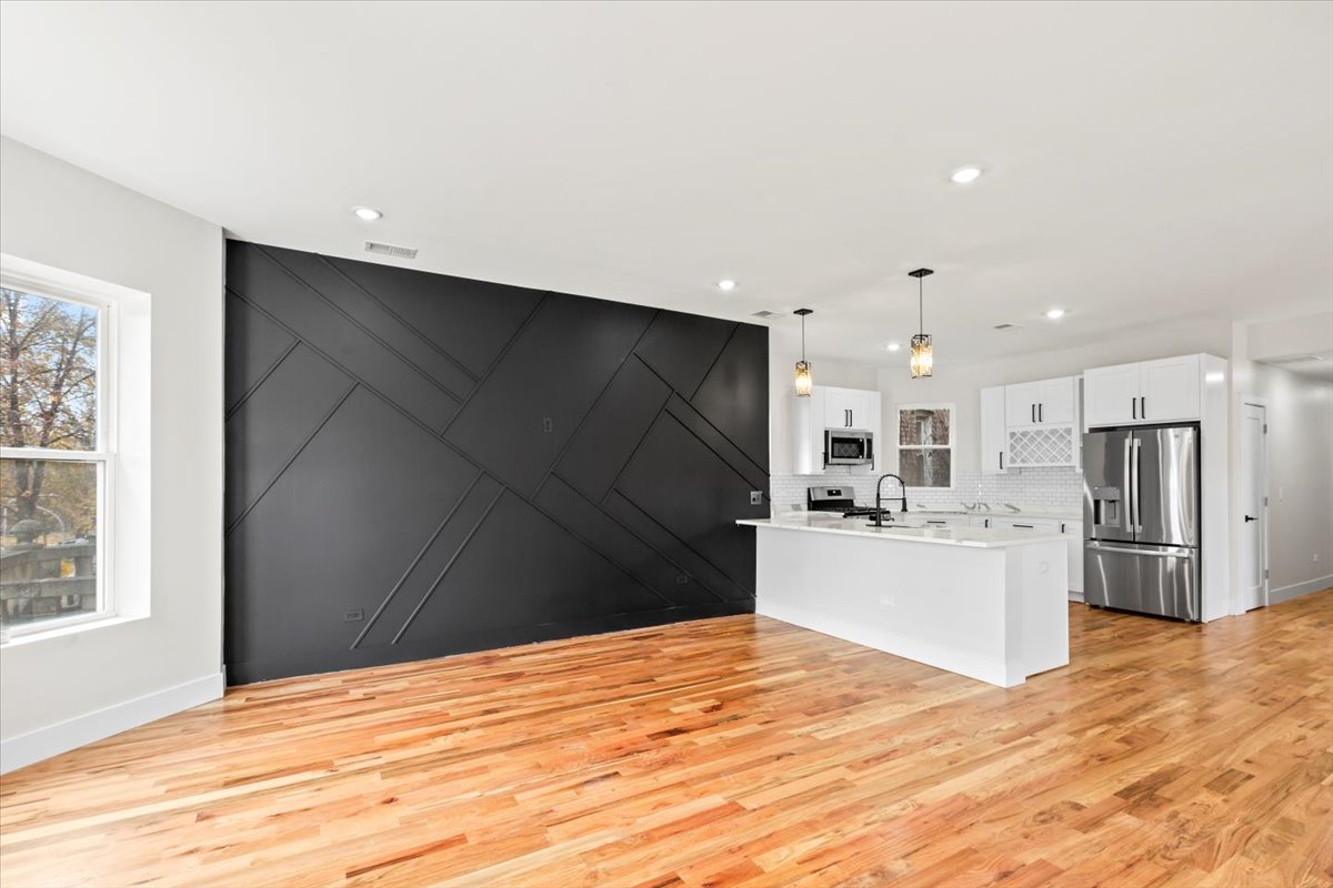 6128 South Rhodes Avenue, Unit 2 Chicago, IL 60637 - Photo 2 of 12 a kitchen with a refrigerator and a stove top oven