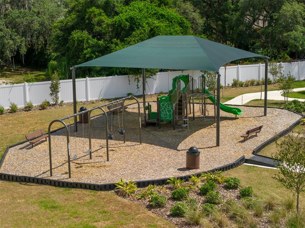 6146 Success Way St. Cloud, FL 34771 - Photo 5 of 6 a swimming pool with some trees in the background